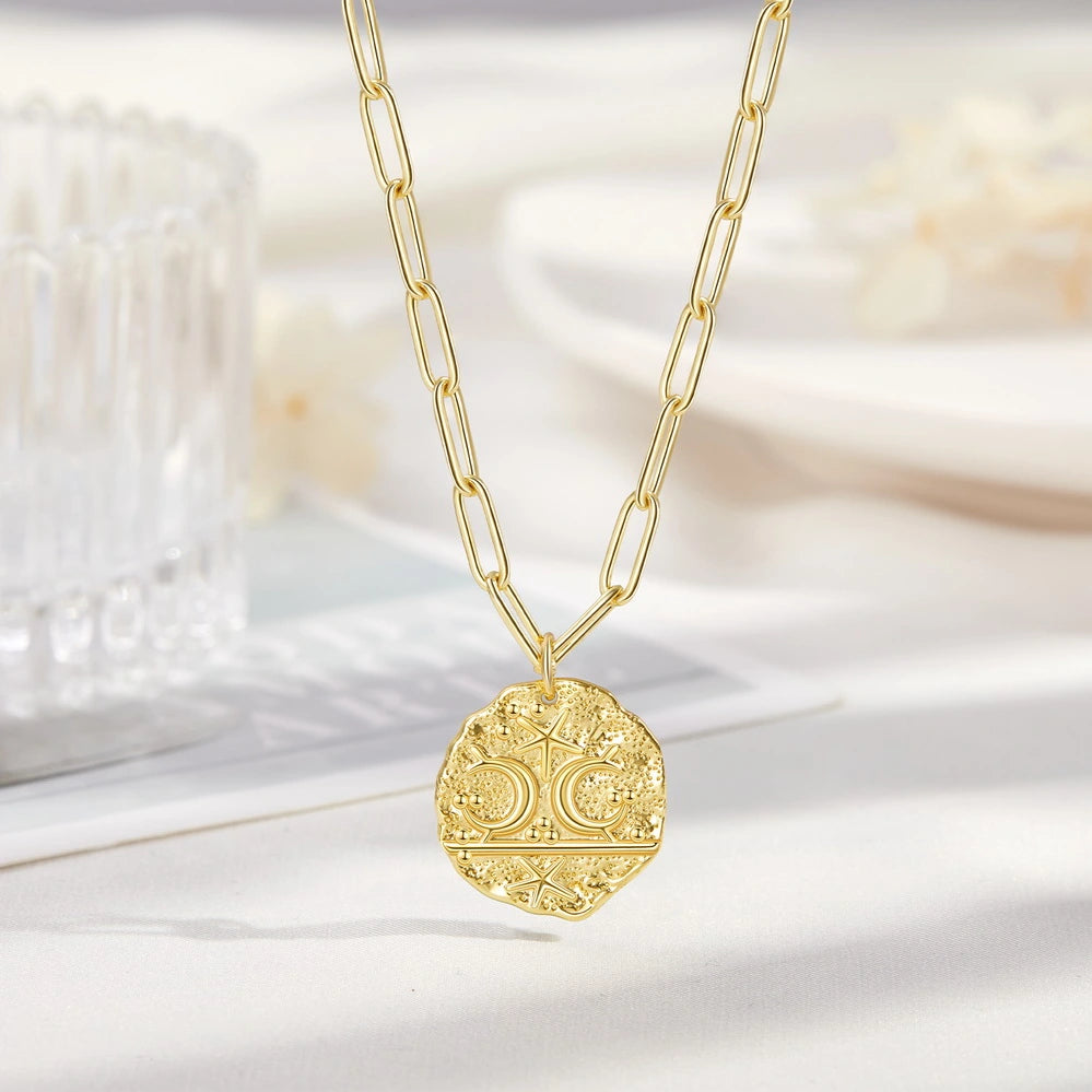 14K Gold Layered Moon Star Medallion Necklace showcasing its celestial charm