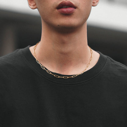 Close-up of 14K Gold Layered Necklaces - Cuban, Rope, Paperclip