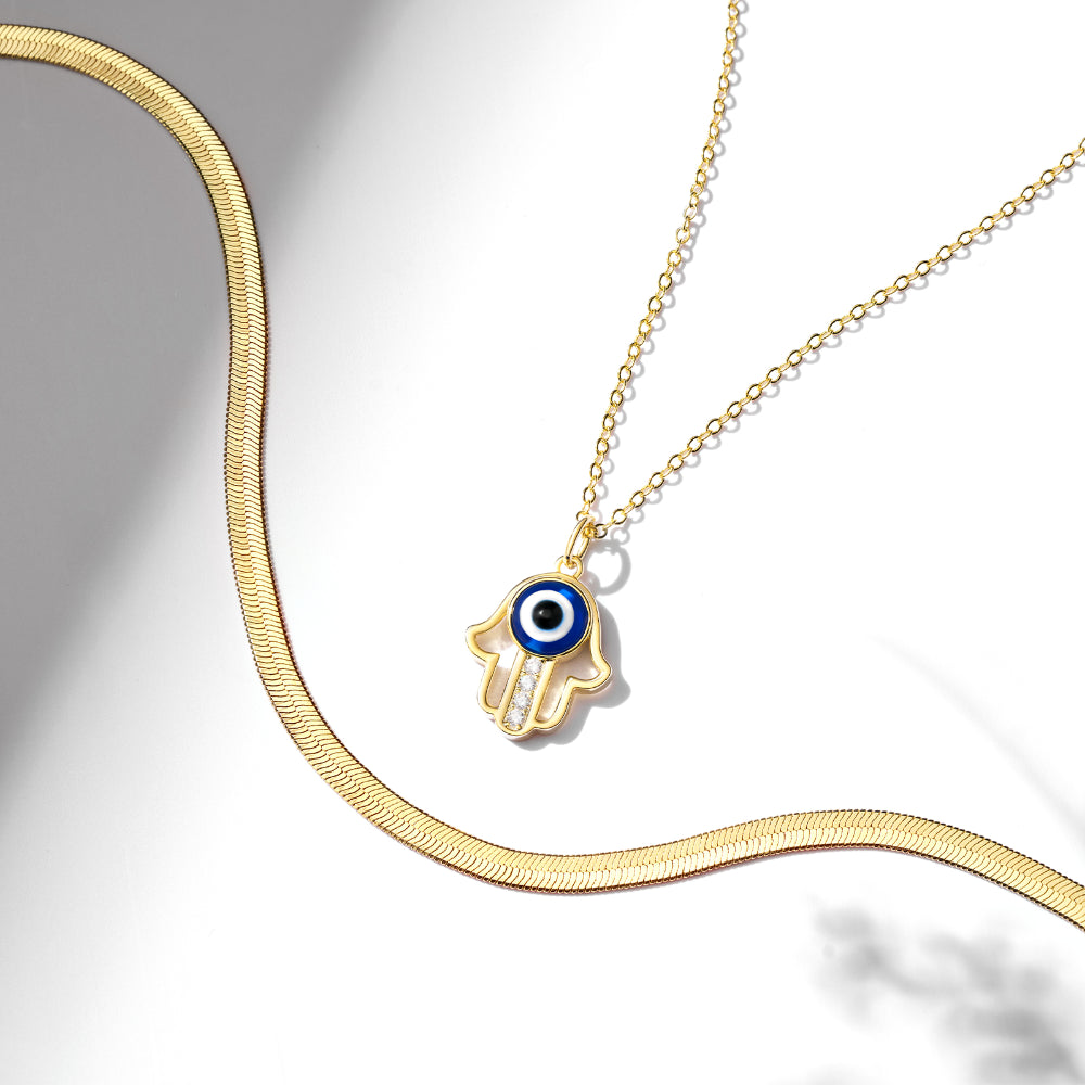 14K Gold Layered Evil Eye Necklace showcasing its captivating design